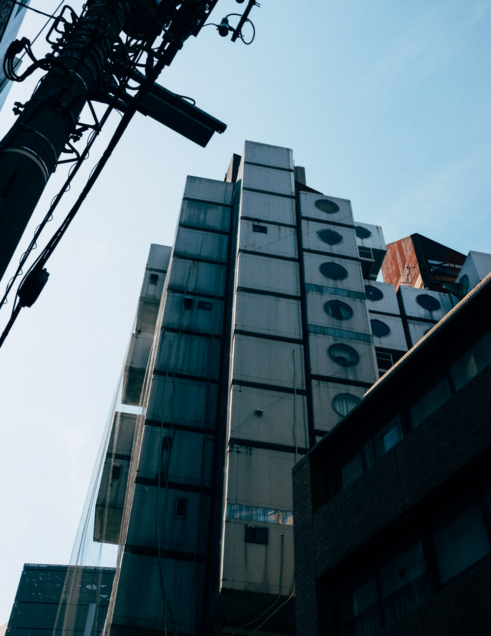 Looking up at Nagakin Capsule Tower.